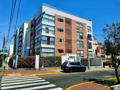 a car is parked in front of a building at DuplexTOP Miraflores Queen SmartTV Lima 1B 101 in Lima