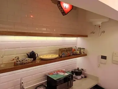 a kitchen with a counter top with a stove top oven at Departamento boutique in Lima