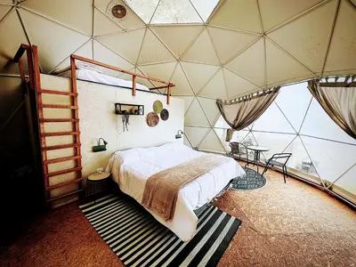a bedroom in a dome shaped room with a bed at Amaya Experience in Miraflores