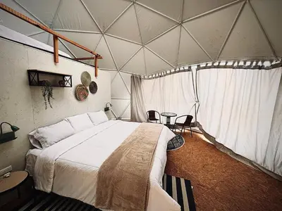 a bedroom with a large bed in a tent at Amaya Experience in Miraflores