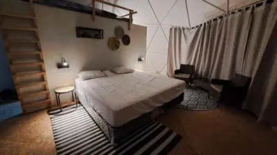 a bedroom with a bed and a staircase in it at Amaya Experience in Miraflores
