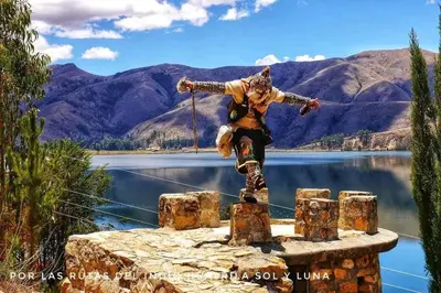a statue of a man standing on a stump next to a lake at Hospedaje Mónaco - Jauja Airport in Jauja