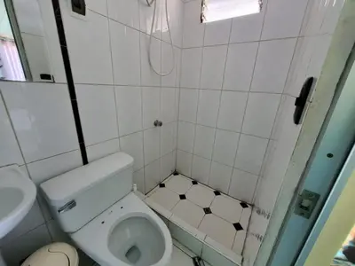 a small bathroom with a toilet and a sink at Jebas House in Cusco