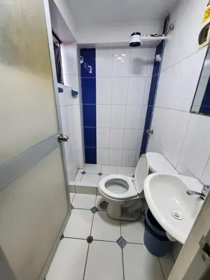a small bathroom with a toilet and a sink at Jebas House in Cusco