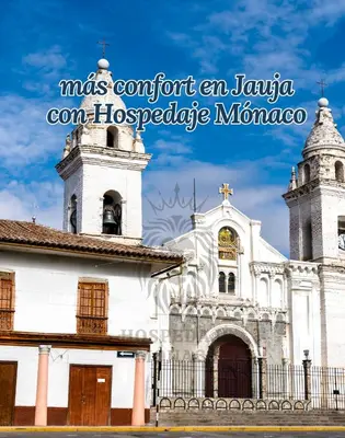 a white church with two towers and a fence at Hospedaje Mónaco - Jauja Airport in Jauja