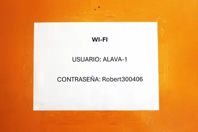 a white sign on the side of a wall at Departamento Completo en San Luis - Complete Apartment in San Luis in Lima