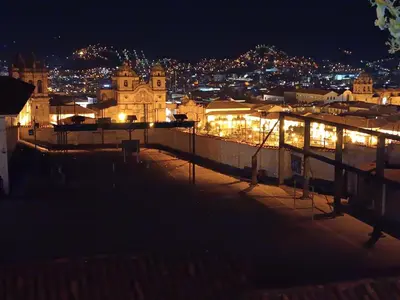 a view of a city at night with lights at Mini Apart I - Sumaq Wasi Alba in Cusco