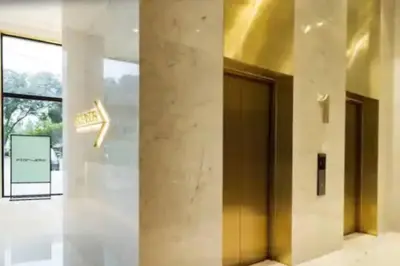 a door to a building with a sign on the wall at Great view and Pool apartment in Lima