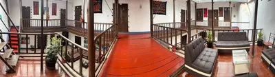 a view of a stage with chairs and a red carpet at Mallku Wasi - Lodging Hotel Cusco in Cusco