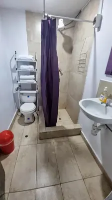 a bathroom with a toilet and a sink at Mallku Wasi - Lodging Hotel Cusco in Cusco