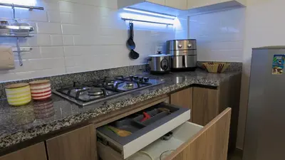 a kitchen with a stove and a counter top at Hermoso apartamento en San Isidro in Lima