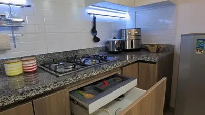a kitchen with a stove and a counter top at Hermoso apartamento en San Isidro in Lima