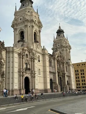 a large building with people standing in front of it at Sai in Lima