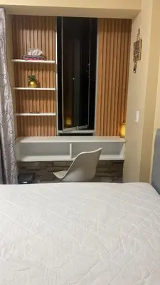 a bedroom with a bed and a window at Sai in Lima