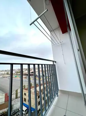 a balcony with a view of a building at Departamento estrenó céntrico a universidades in Lima