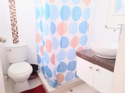a bathroom with a toilet and a sink at Centro Histórico de Lima, Departamentos Temporales in Lima