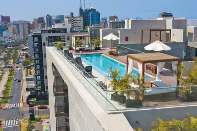a swimming pool on the roof of a building at Miraflores Centre Boutique Apartment 101B in Lima