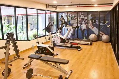 a gym with several exercise bikes in a room at Miraflores Centre Boutique Apartment 101B in Lima