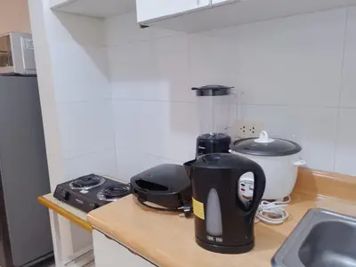 a kitchen counter with a coffee maker and a blender at Departamentos Céntricos en Lima in Lima