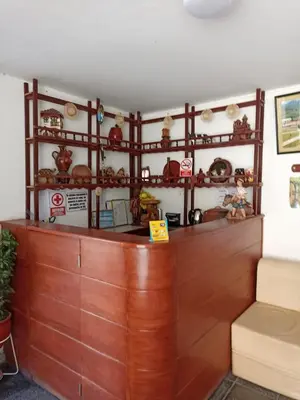 a bar in a room with wooden counter top at Hostal Cielo Azul in Canta