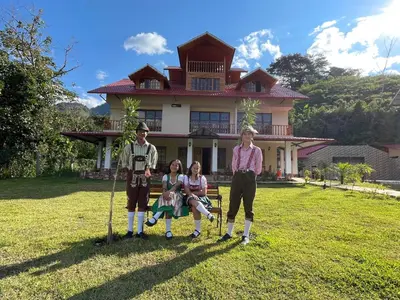 a group of people standing in front of a house at MONTEVERDIA - Hotel & Resort in Pozuzo