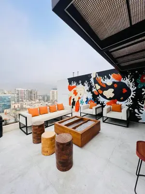 a living room with couches and a mural on a wall at MONTERRICO POLO APARTS #17 - Dpto de estreno con Balcón Frente Embajada USA in Lima