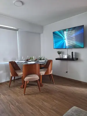 a dining room with a table and chairs at Modern 1-Bedroom Apartment with WiFi in Miraflores in Lima