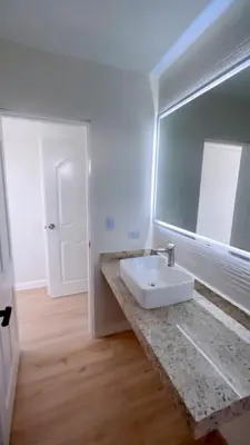 a bathroom with a sink and a mirror at CA3 - Casa de Lujo, Fiesta y Piscina - Punta hermosa in Punta Hermosa