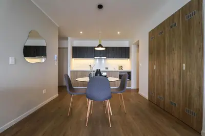 a dining room and kitchen with a table and chairs at Liven in Miraflores by Wynwood House in Lima