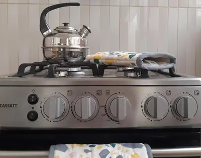 a tea pot sitting on top of a stove at Lily House in Ica