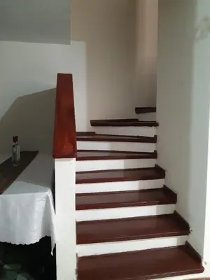 a stairway with brown and white stairs in a room at Lily House in Ica