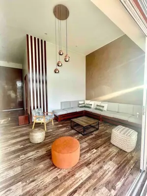 a living room with a couch and a table at La Finca Ica in Ica