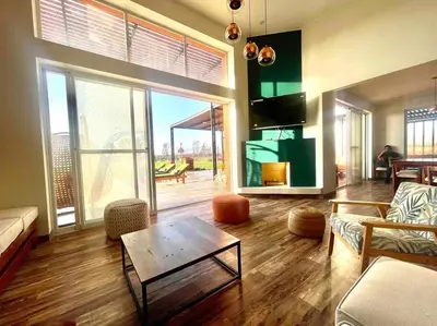 a living room with a couch and a table at La Finca Ica in Ica