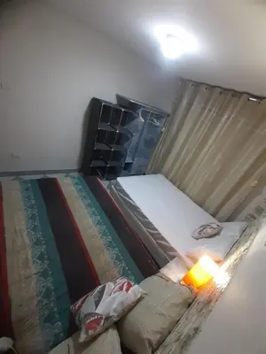 a bedroom with a bed and a lamp in it at Just for me in Lima