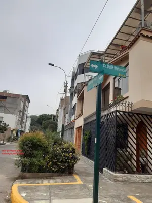 a street sign in front of a building at Just for me in Lima
