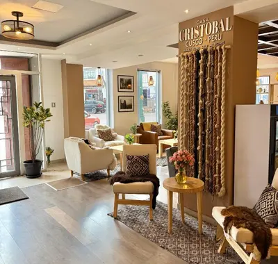 a lobby with couches and chairs in a store at CASA CRISTOBAL Centenario in Cusco