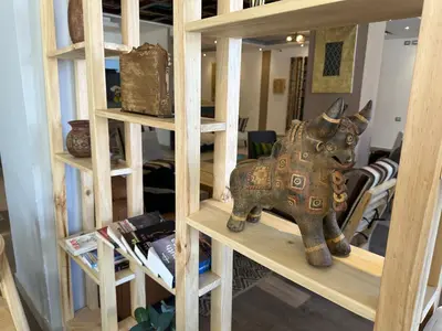 a wooden elephant on a shelf in a room at CASA CRISTOBAL Centenario in Cusco