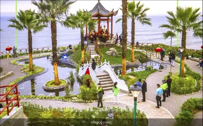 a group of people walking around a theme park at Departamento Pardo Miraflores in Lima