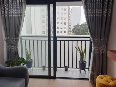 a balcony with potted plants and a window at Departamento Pardo Miraflores in Lima