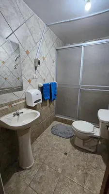a bathroom with a sink and a toilet and a shower at Casa Independiente muy cerca al centro historico - Los Profesionales in Cusco