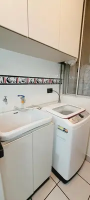 a small kitchen with a sink and a counter at Departamento cerca al Centro Histórico de Lima in Lima