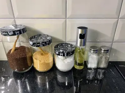 a kitchen counter with four containers of food and spices at Cómodo y silencioso Apartamento 1BR en Barranco in Lima