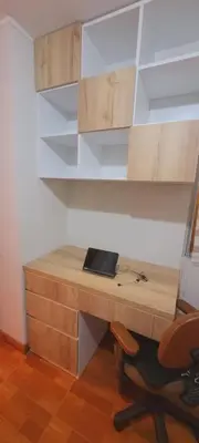 a wooden desk with a chair in a room at Departamento completo cerca al Centro Histórico de Lima y al aeropuerto in Lima