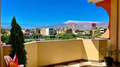 a balcony with a view of a city and mountains at Hospedaje Sol de Oro in Nazca