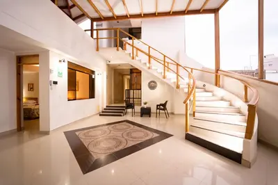 a staircase in a house with a rug on the floor at Hostal Los Balcones in Nazca