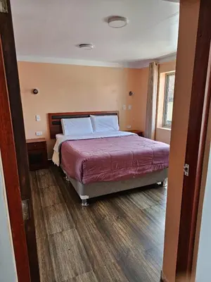 a bedroom with a large bed in a room at Hospedaje Paqcha in Cusco