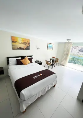 a bedroom with a large bed in a room at Villasol Hotel in Lunahuaná