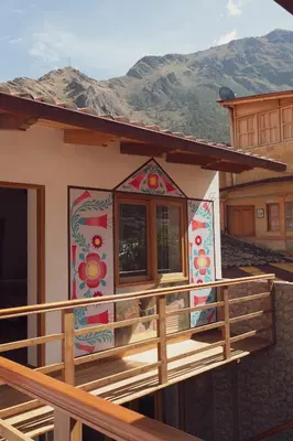 a house with a mural on the side of it at Casa Alba Ollantaytambo in Ollantaytambo