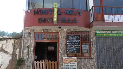 a restaurant with a sign on the front of it at IntiKilla in Mollepata