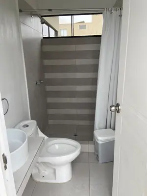 a bathroom with a white toilet and a sink at Casa de Campo en Cieneguilla in Hacienda Cienguilla